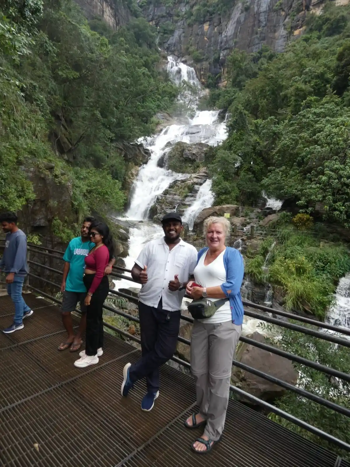 Travelers visiting a waterfall in Ella Sri Lanka